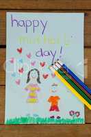 Happy mothers day greeting card on wooden background