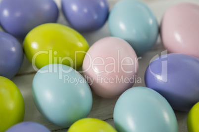 Multicolored Easter eggs on wooden surface