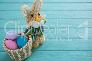 Basket with Easter eggs and toy Easter bunny