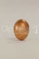 Golden eastern egg on white background