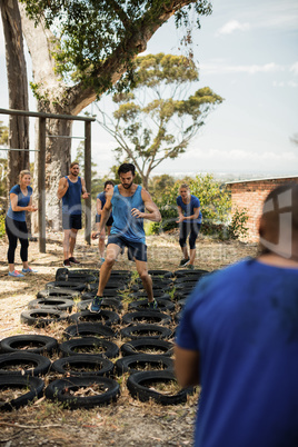 Man receiving tire obstacle course training