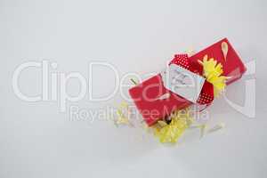 Gift box with happy mothers day tag and yellow flower