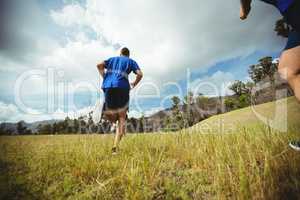 Fit man running in bootcamp