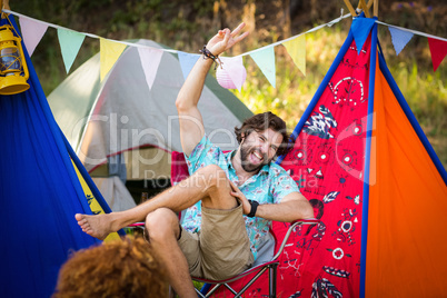 Man sitting near campsite