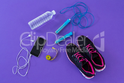 Fitness accessories, measuring tape and mobile phone with headphones