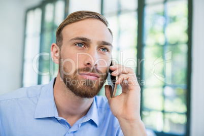 Executive talking on mobile phone