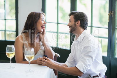 Man proposing a woman with a ring