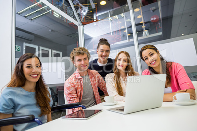 Portrait of smiling executives in conference room
