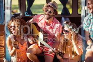 Group of friends having fun at music festival