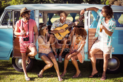 Group of friends having fun at music festival