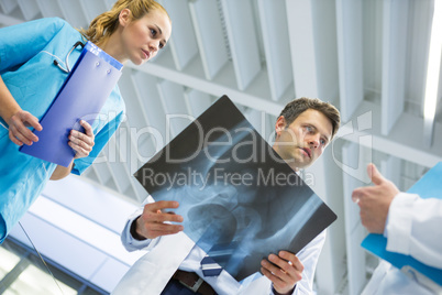 Doctors and surgeon discussing x-ray
