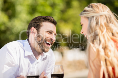 Couple laughing while sitting