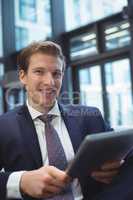 Businessman using digital tablet at office