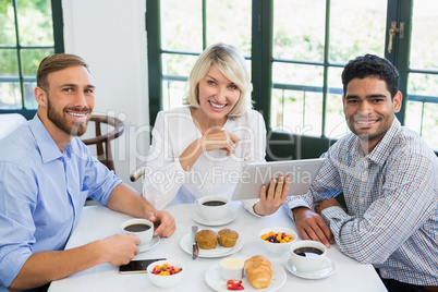 Smiling executives in a restaurant