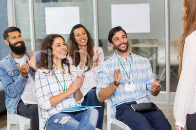 Executives appreciating their colleague during presentation