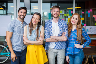 Smiling executives standing together in office