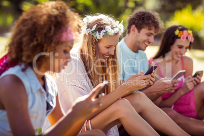 Group of friends using mobile phone