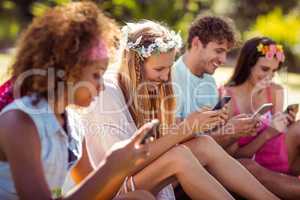 Group of friends using mobile phone