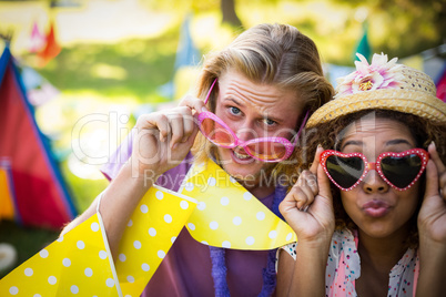 Friends in fancy sunglasses at music festival