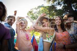 Group of friends dancing at music festival