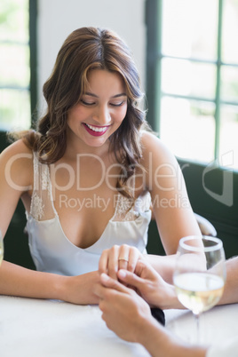 Man holding womans hand