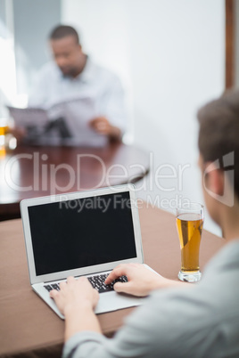 Man using laptop in the restaurant