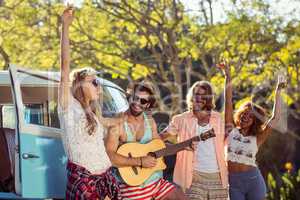 Group of friends having fun at music festival