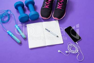 Fitness accessories with opened book and mobile phone