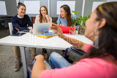 Executives interacting with each other in conference room
