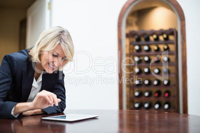 Businesswoman using digital tablet in a restaurant