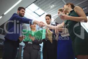 Business executives shaking hands