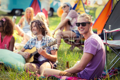 Group of friends having fun together at campsite