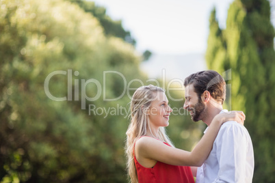 Couple smiling while looking at each other