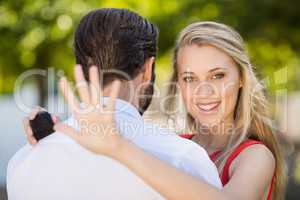 Beautiful woman looking at her ring