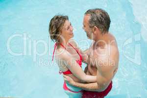 Couple romancing in swimming pool