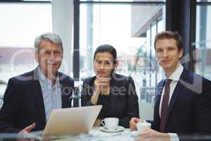 Portrait of smiling businesspeople