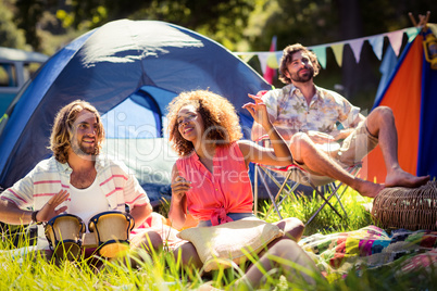 Friends having fun together at campsite