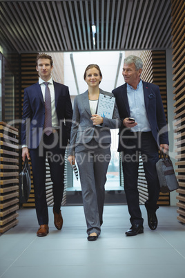 Businesspeople walking in corridor