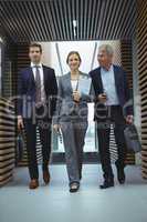 Businesspeople walking in corridor