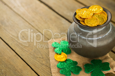 St. Patricks Day shamrock and pot filled with chocolate gold coins