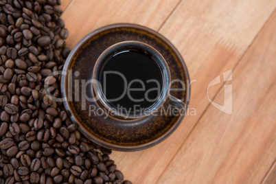 Black coffee with roasted coffee beans