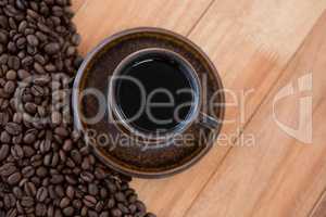 Black coffee with roasted coffee beans