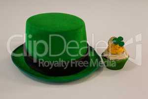 St Patricks Day leprechaun hat with shamrock on cupcake