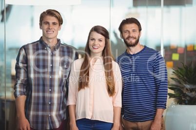 Happy business executives standing in office