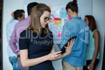 Business executive using digital tablet in office