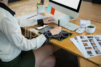 Female graphic designer working at desk