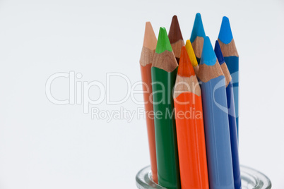 Close-up of colored pencils kept in a glass jar
