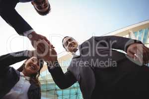 Businesses executives forming a hand stack