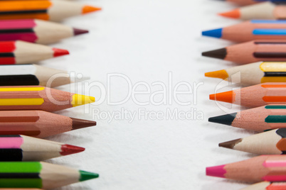 Close-up of colored pencils arranged in a row