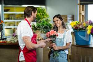 Florist interacting with female customer